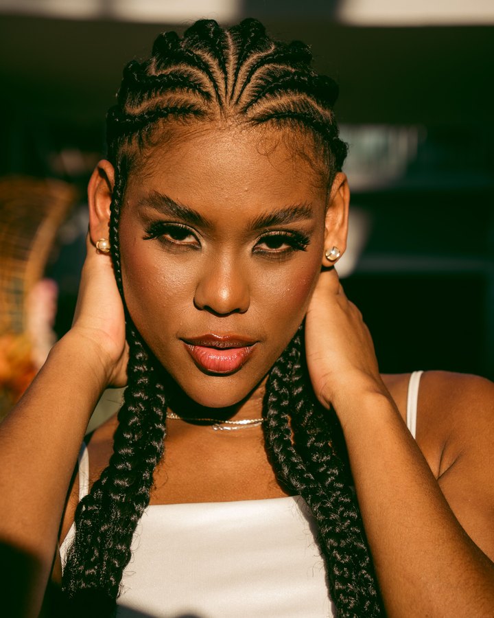 Designed cornrows flowing into braids