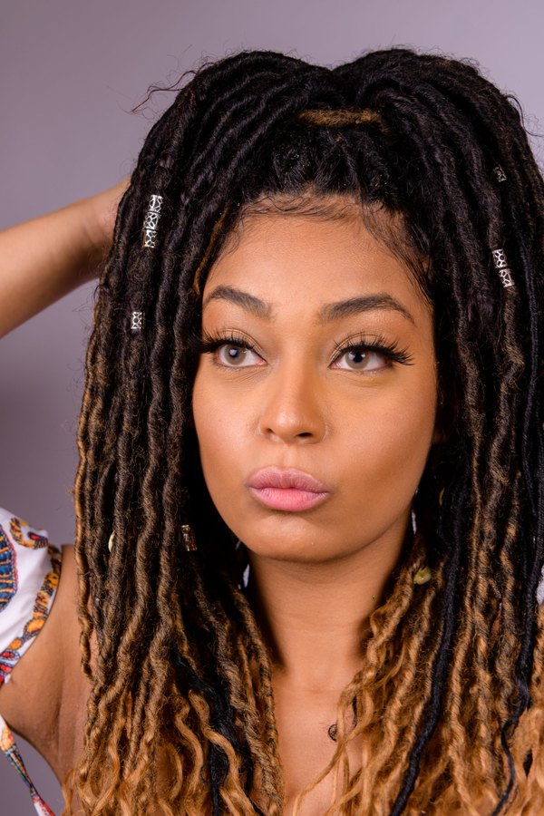 Faux locs with honey-blonde ends