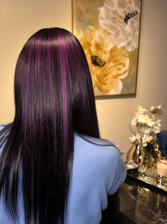 Sleek straight hair with purple highlights